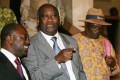 Le President Laurent Gbagbo entoure de Amouzou et Tape Doh